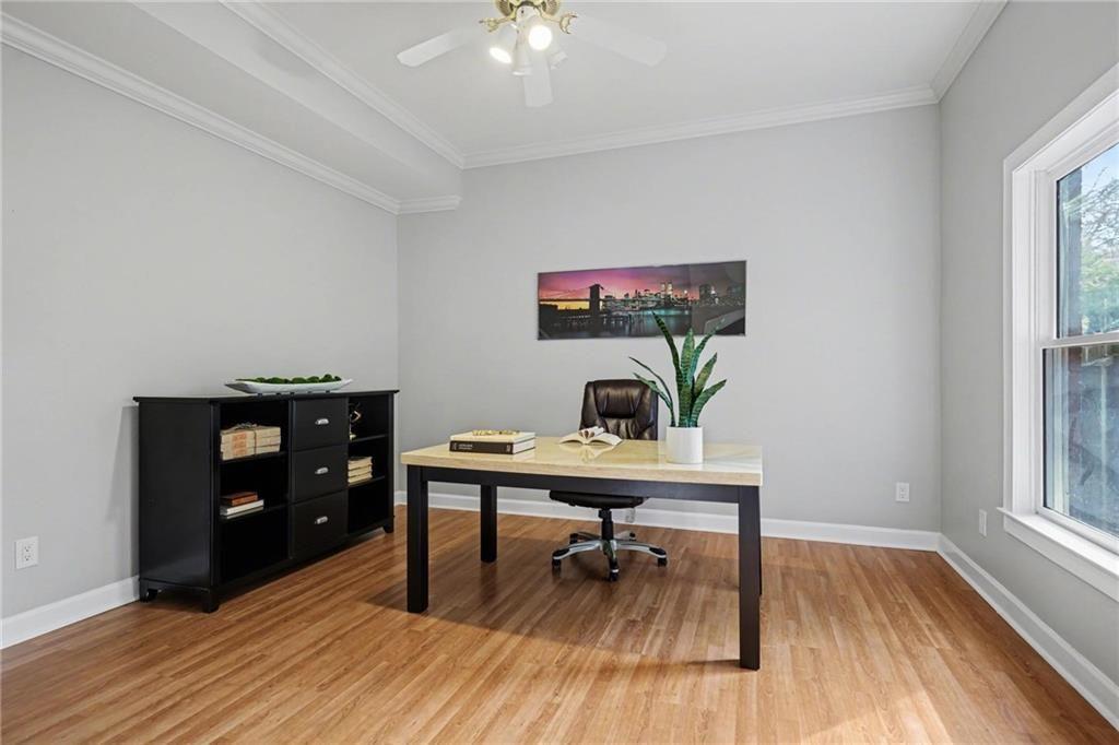 225 Farmbrooke Court Atlanta, GA 30350 - Photo 69 of 84 a living room with furniture and a wooden floor