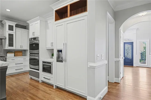 a living room with furniture potted plant and a window