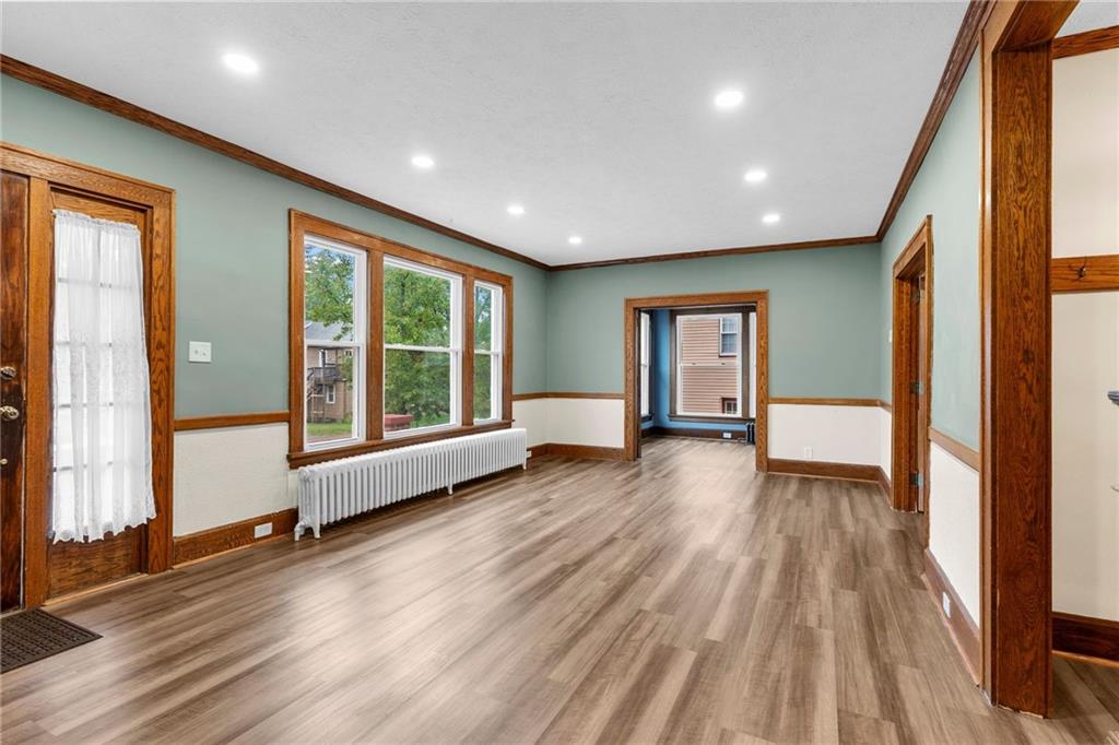 895 Alcoma Street Sharon, PA 16146 - Photo 11 of 41 a view of an empty room with wooden floor and a window