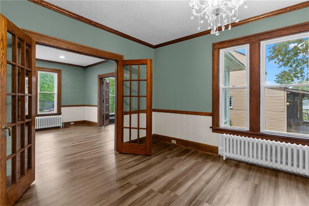 895 Alcoma Street Sharon, PA 16146 - Photo 12 of 41 a view of a livingroom with wooden floor and furniture