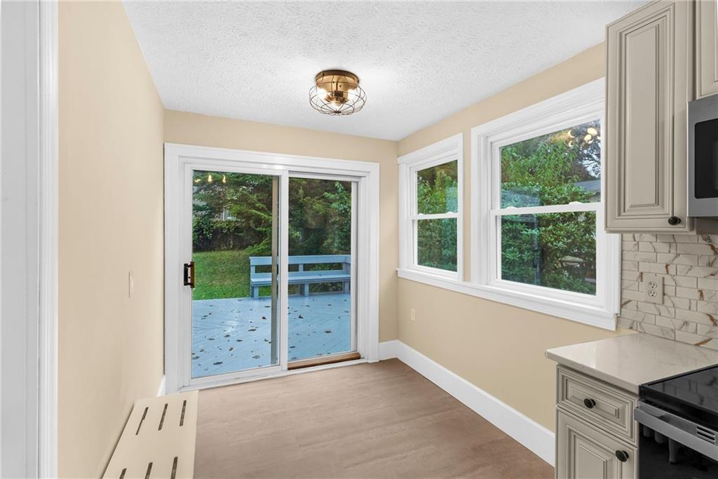 895 Alcoma Street Sharon, PA 16146 - Photo 19 of 41 a view of a livingroom with a window and kitchen
