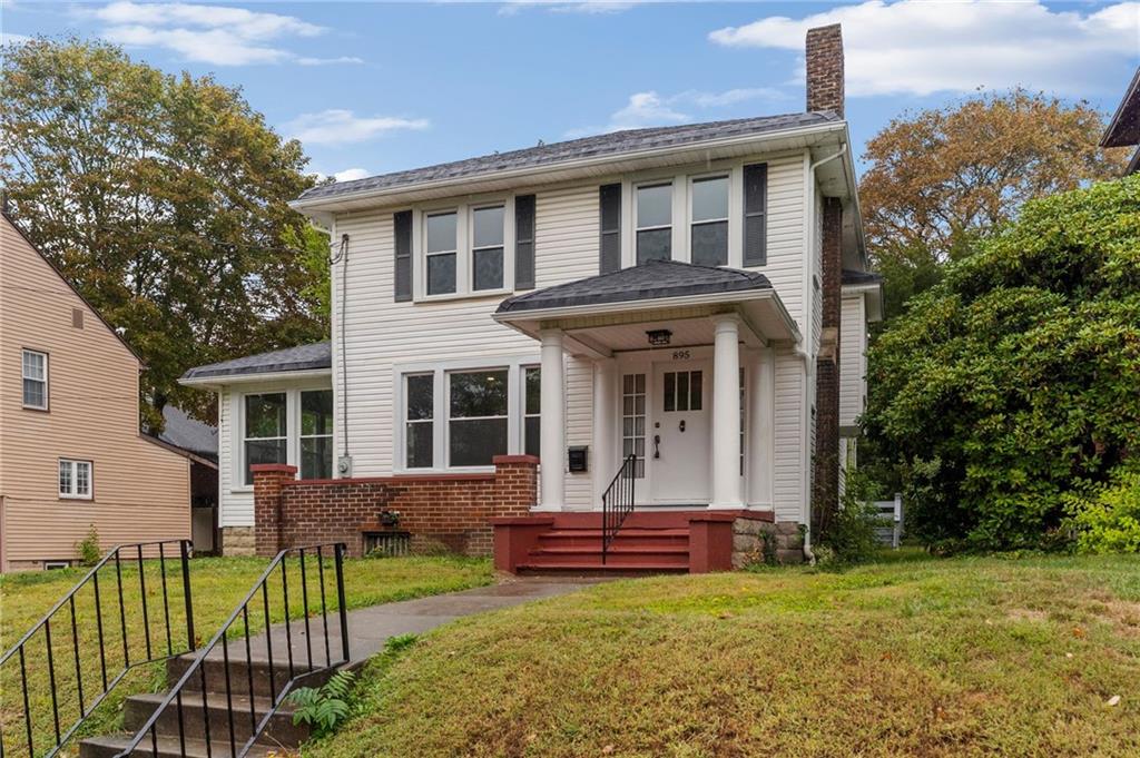 895 Alcoma Street Sharon, PA 16146 - Photo 2 of 41 a view of a house with a yard and sitting area