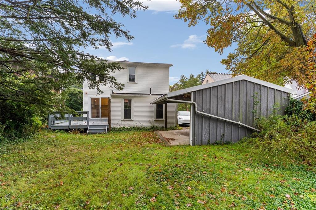 895 Alcoma Street Sharon, PA 16146 - Photo 35 of 41 a view of a backyard with a garden