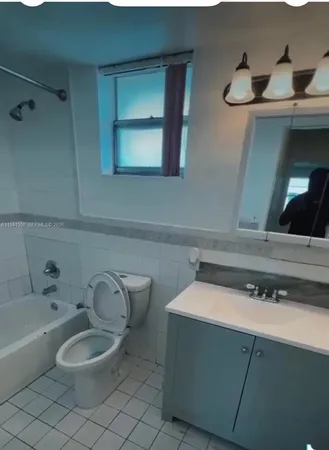a bathroom with a toilet and a sink