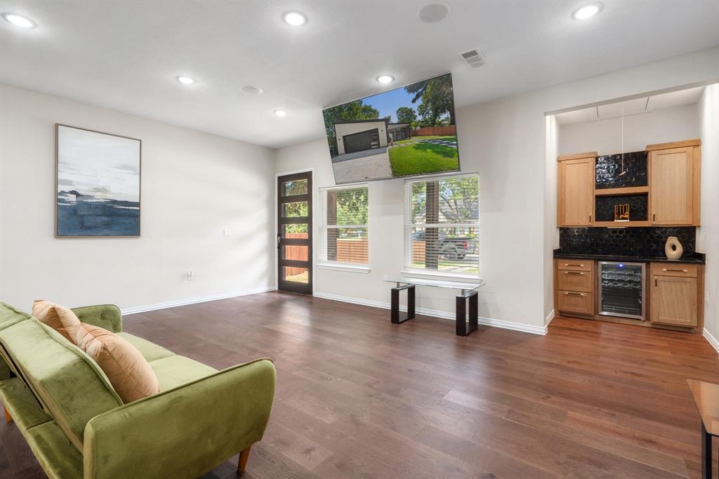 2514 Carpenter Avenue Dallas, TX 75215 - Photo 4 of 24 a living room with furniture and a flat screen tv