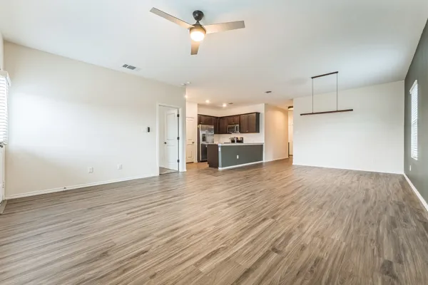 a view of a kitchen with a dishwasher and a stove top oven