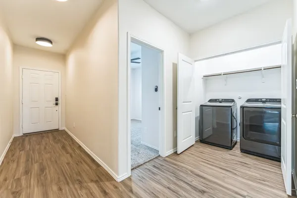 a view of a kitchen from a hallway