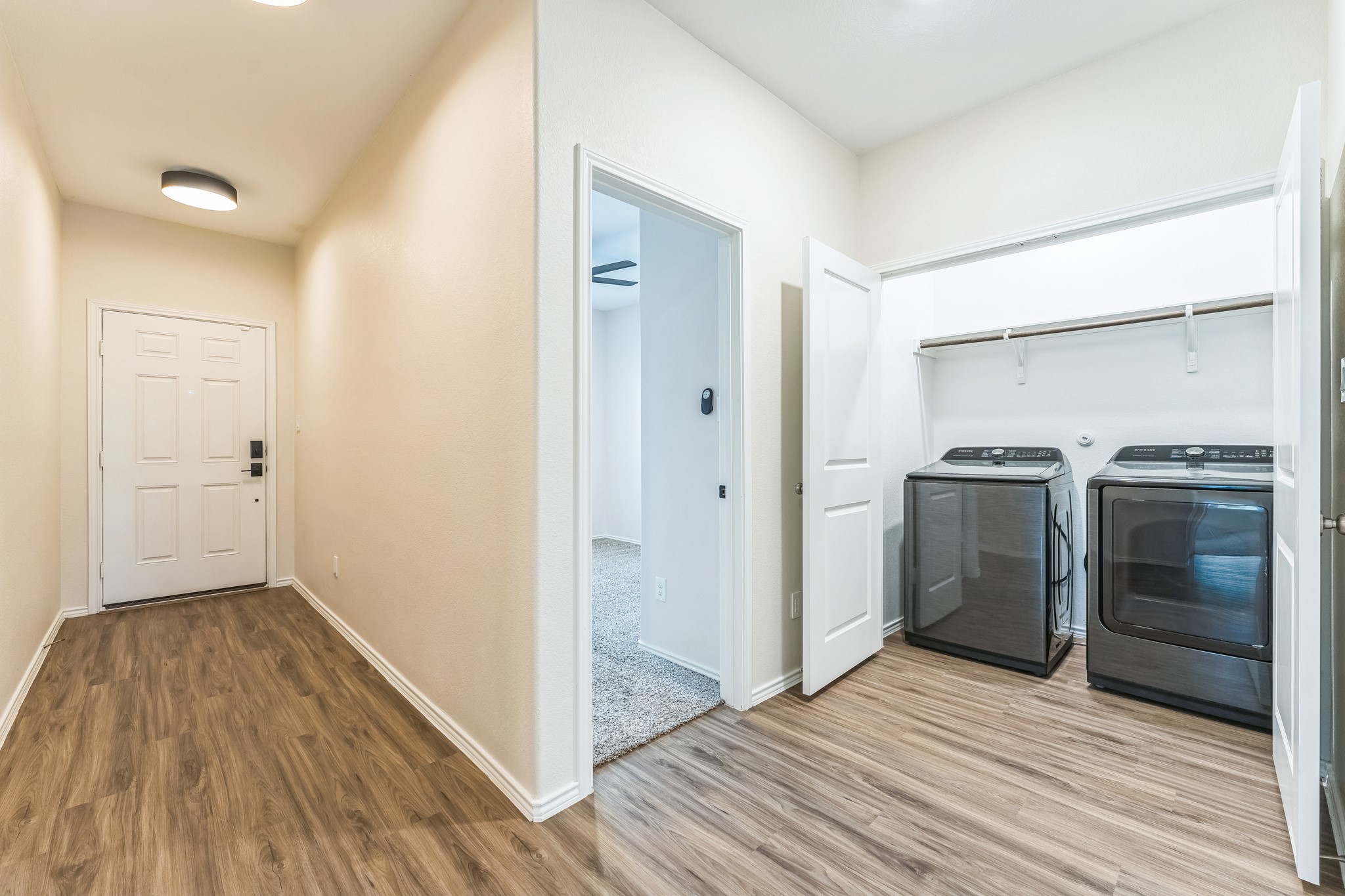 108 Fighting Seabees Run Jarrell, TX 76537 - Photo 5 of 19 a view of a kitchen from a hallway