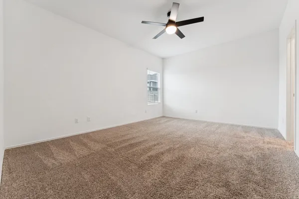 a view of a big room with carpet