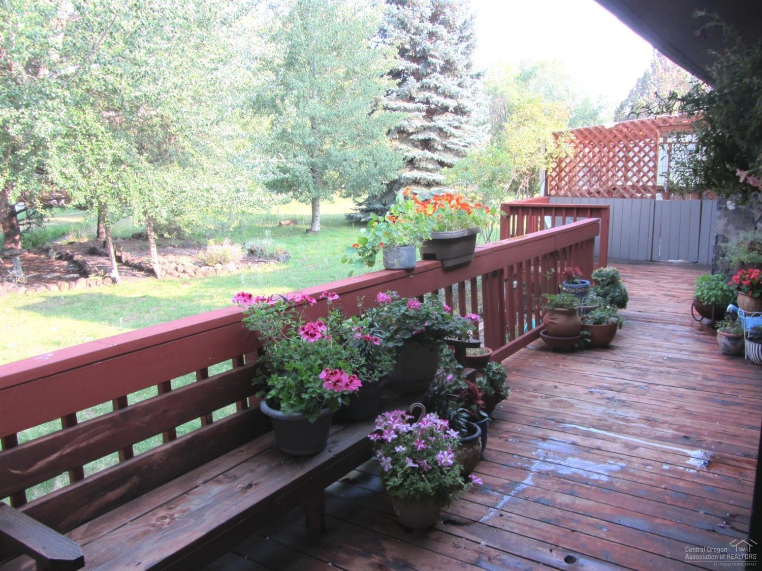 21452 Keyte Lane Bend, OR 97701 - Photo 15 of 25 Another view of the back deck with bench