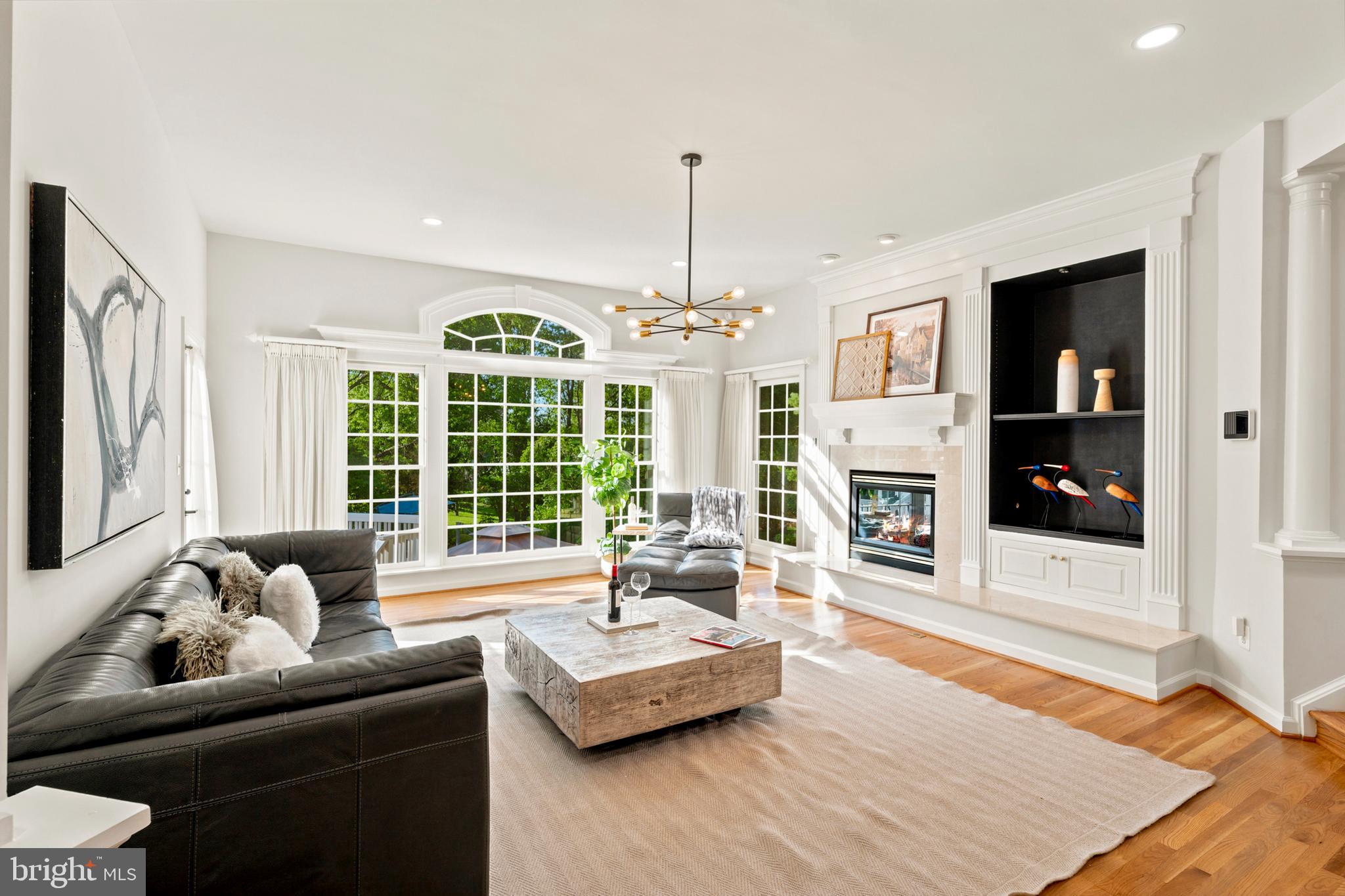 9313 Harrisons Farm Way Laytonsville, MD 20882 - Photo 20 of 77 a living room with fireplace furniture and a large window
