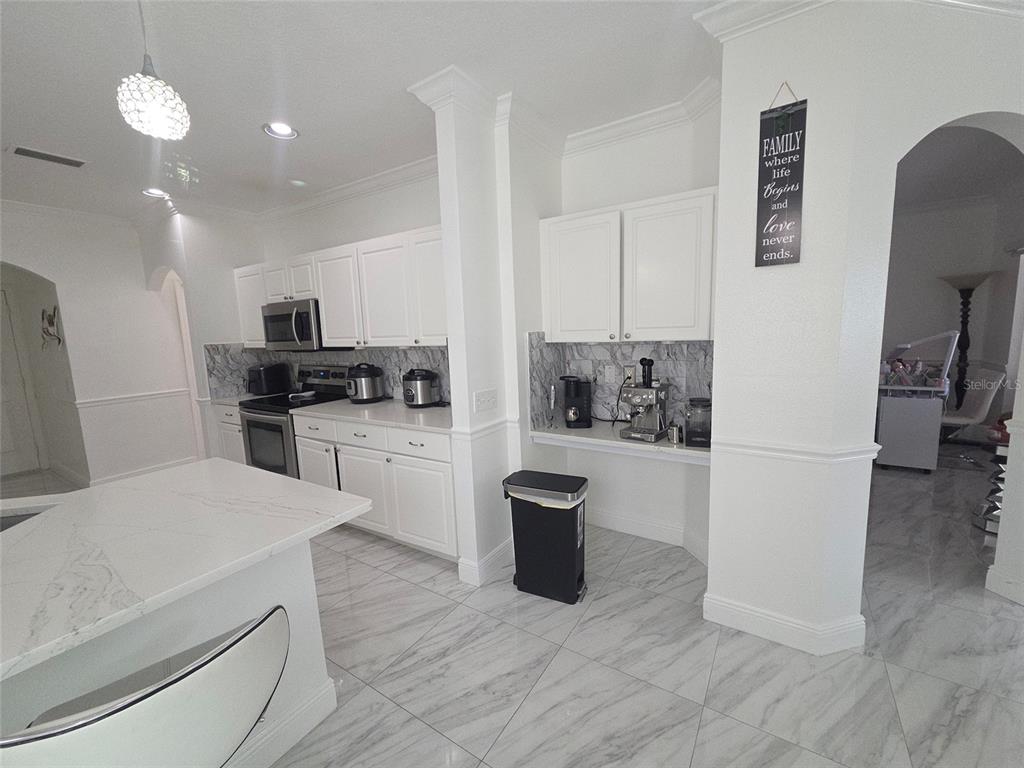 4162 Day Bridge Place Ellenton, FL 34222 - Photo 17 of 49 a kitchen with a refrigerator and a stove top oven