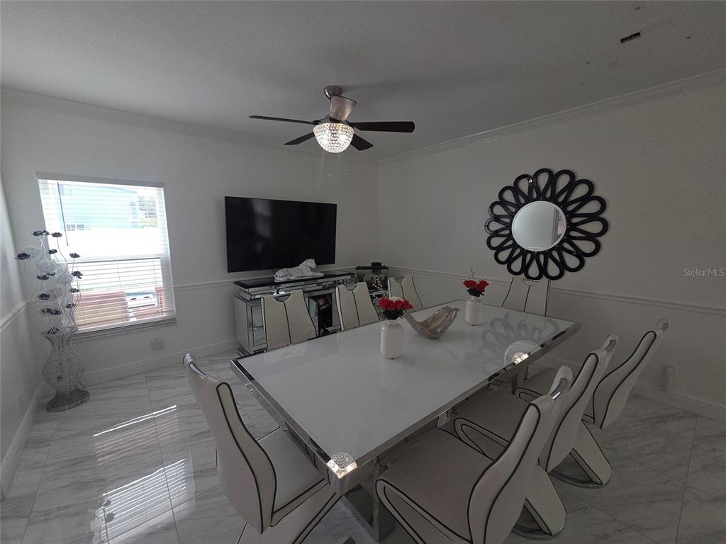 4162 Day Bridge Place Ellenton, FL 34222 - Photo 22 of 49 a kitchen with a table and chairs in it