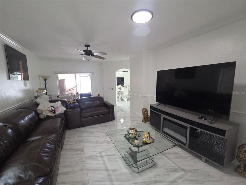4162 Day Bridge Place Ellenton, FL 34222 - Photo 23 of 49 a living room with furniture and a flat screen tv