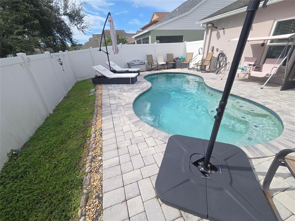 4162 Day Bridge Place Ellenton, FL 34222 - Photo 29 of 49 a view of a swimming pool with a porch and furniture