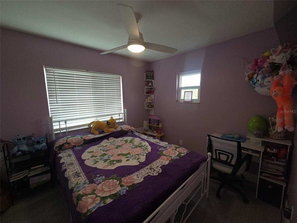 4162 Day Bridge Place Ellenton, FL 34222 - Photo 41 of 49 a bed sitting in a bedroom next to a window
