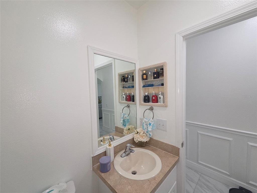 4162 Day Bridge Place Ellenton, FL 34222 - Photo 44 of 49 a bathroom with a sink and a mirror