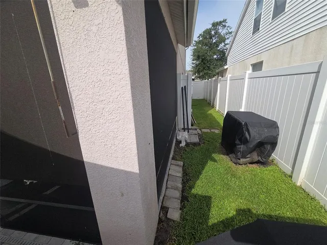 an aerial view of a house with a big yard