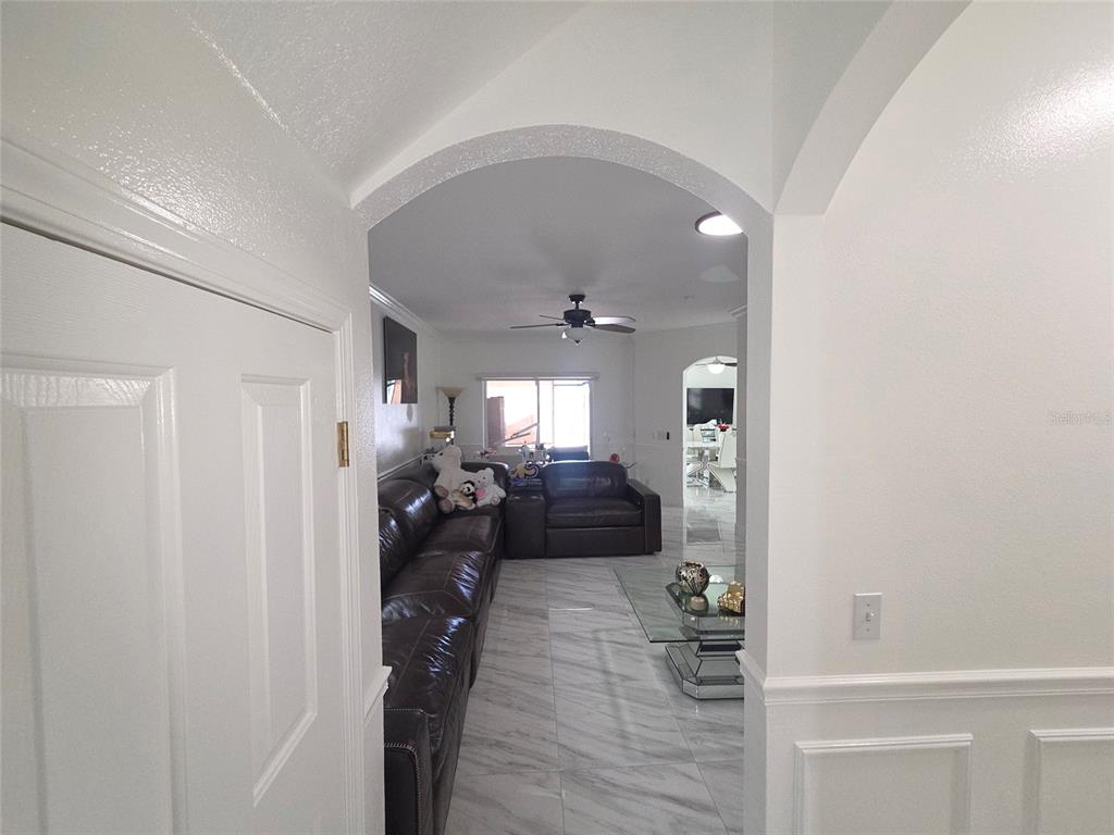 4162 Day Bridge Place Ellenton, FL 34222 - Photo 10 of 49 a living room with furniture and a chandelier
