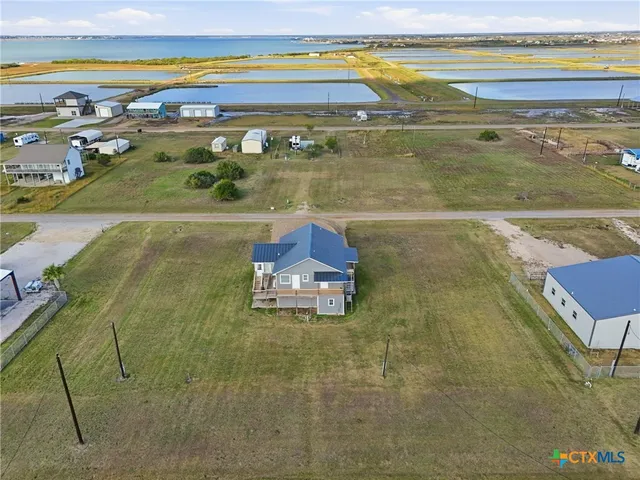 an aerial view of a pool an ocean