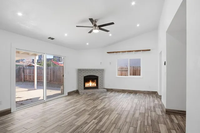 a view of livingroom window wooden floor and front door