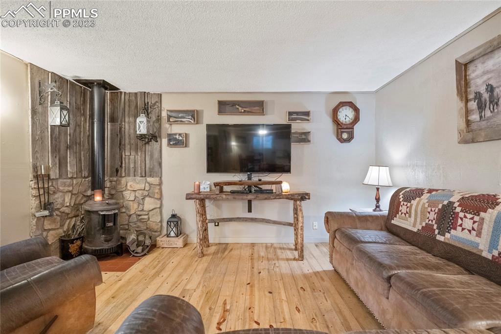 2905 Lauppe Road Yoder, CO 80864 - Photo 11 of 35 a living room with furniture and a flat screen tv