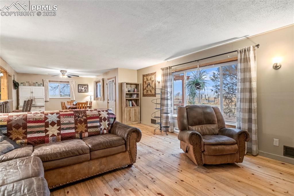 2905 Lauppe Road Yoder, CO 80864 - Photo 12 of 35 a living room with furniture and a large window
