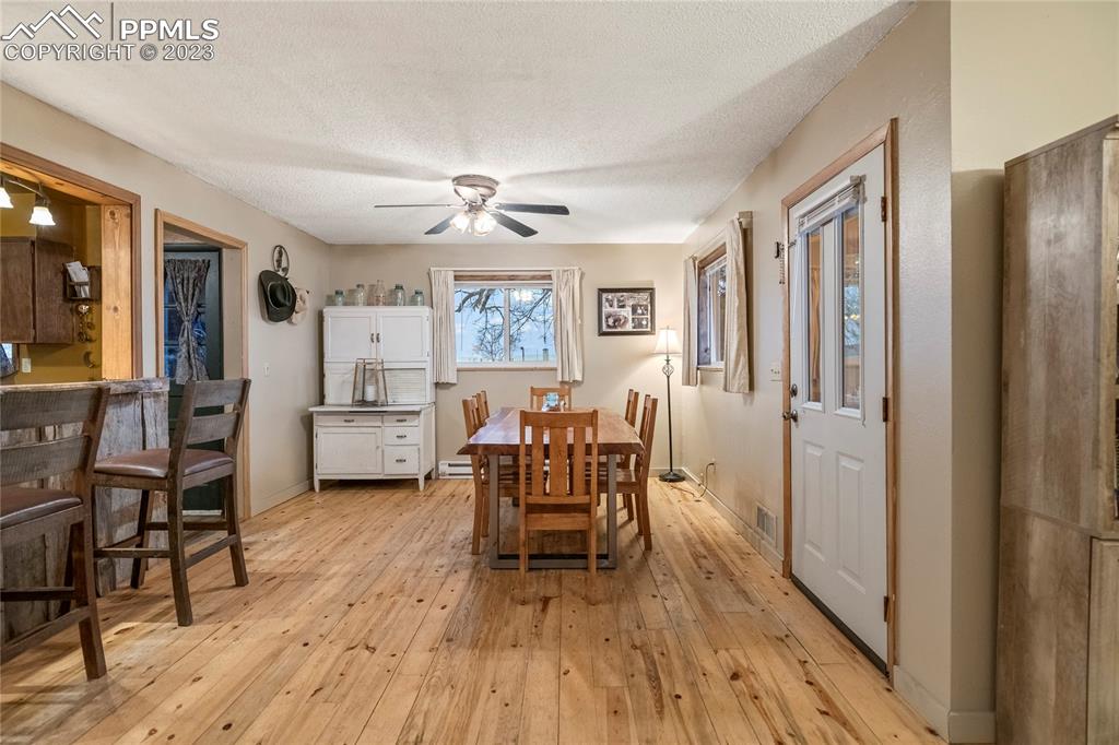 2905 Lauppe Road Yoder, CO 80864 - Photo 13 of 35 a living room with furniture and a wooden floor