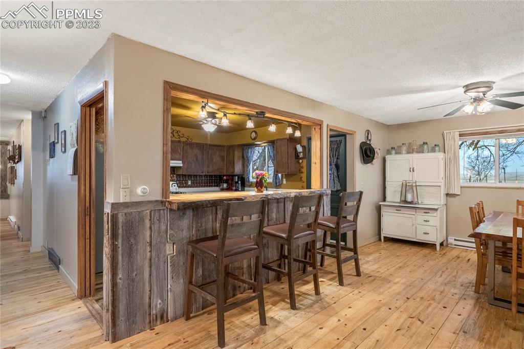 2905 Lauppe Road Yoder, CO 80864 - Photo 15 of 35 a kitchen with stainless steel appliances a table and chairs in it
