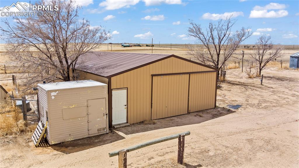 2905 Lauppe Road Yoder, CO 80864 - Photo 2 of 35 a backyard of a house