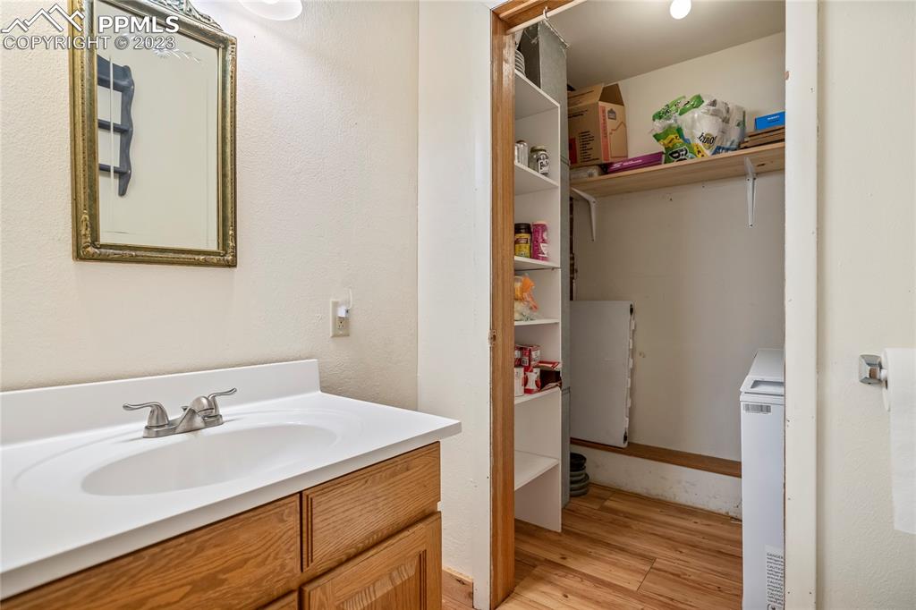 2905 Lauppe Road Yoder, CO 80864 - Photo 22 of 35 a bathroom with a sink and a mirror