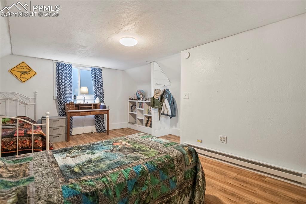 2905 Lauppe Road Yoder, CO 80864 - Photo 25 of 35 a bedroom with a bed and a table in it