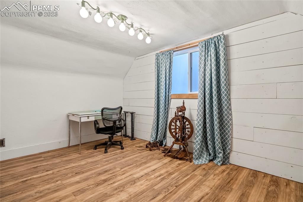 2905 Lauppe Road Yoder, CO 80864 - Photo 26 of 35 a view of a workspace with furniture and a window