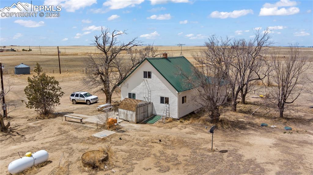 2905 Lauppe Road Yoder, CO 80864 - Photo 33 of 35 a view of a house with a snow in the yard