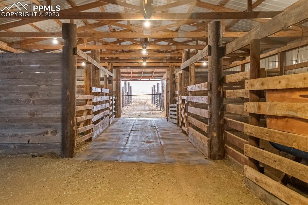 2905 Lauppe Road Yoder, CO 80864 - Photo 4 of 35 a view of an empty room with wooden floor and windows