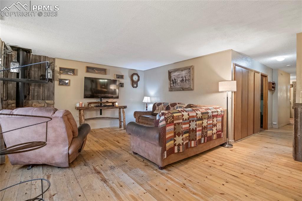2905 Lauppe Road Yoder, CO 80864 - Photo 10 of 35 a living room with furniture and a flat screen tv