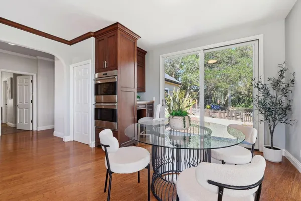 a living room with furniture and large windows