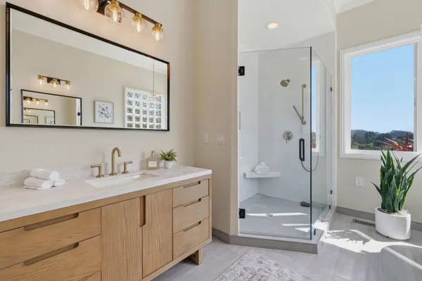 a bedroom with a bed and a mirror