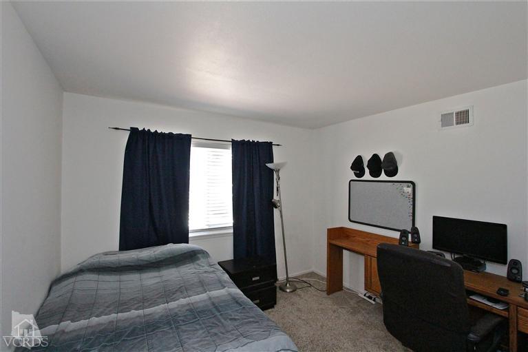 1025 Roldan Avenue Simi Valley, CA 93065 - Photo 22 of 28 a bedroom with a bed and a window