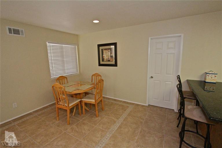 1025 Roldan Avenue Simi Valley, CA 93065 - Photo 7 of 28 a view of a workspace with furniture and a window