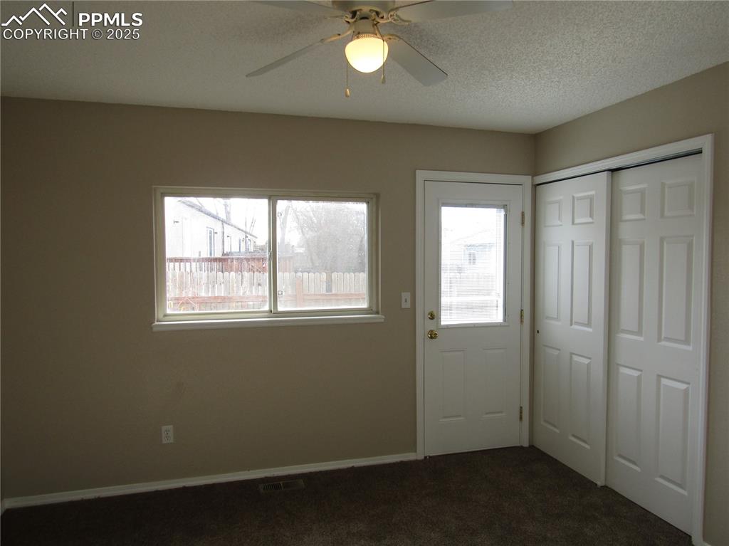331 Trapper Lane Fountain, CO 80817 - Photo 9 of 10 an empty room with windows