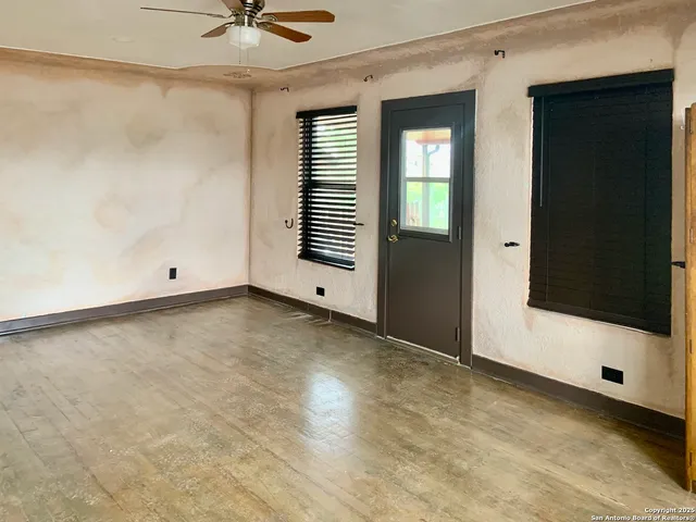 a view of an empty room with a window