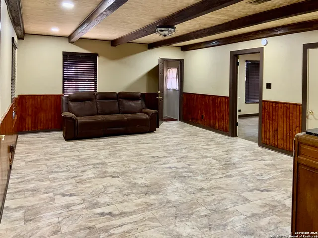 a room with a bed and a dresser