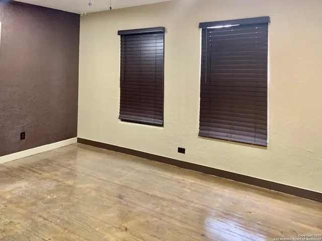 an empty room with windows