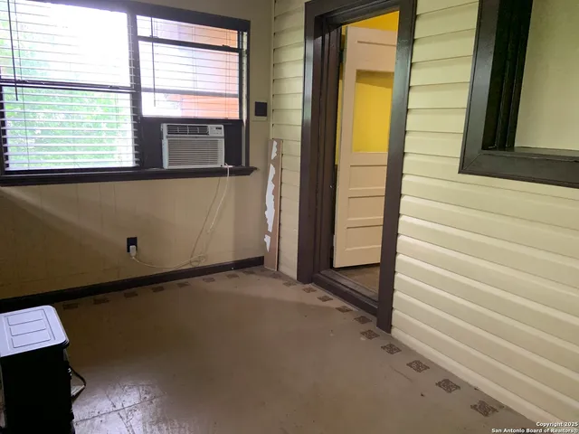 a view of an empty room and window