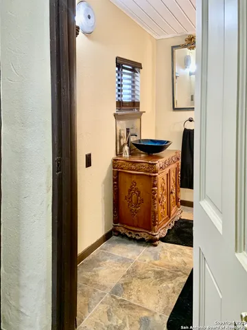 a view of house with backyard and outdoor seating