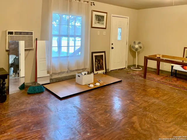 a blue and white door with a trees in the background