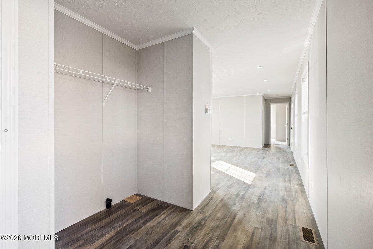 1820 State Rte 35, Unit 16 Wall, NJ 07719 - Photo 17 of 24 a view of hallway with wooden floor