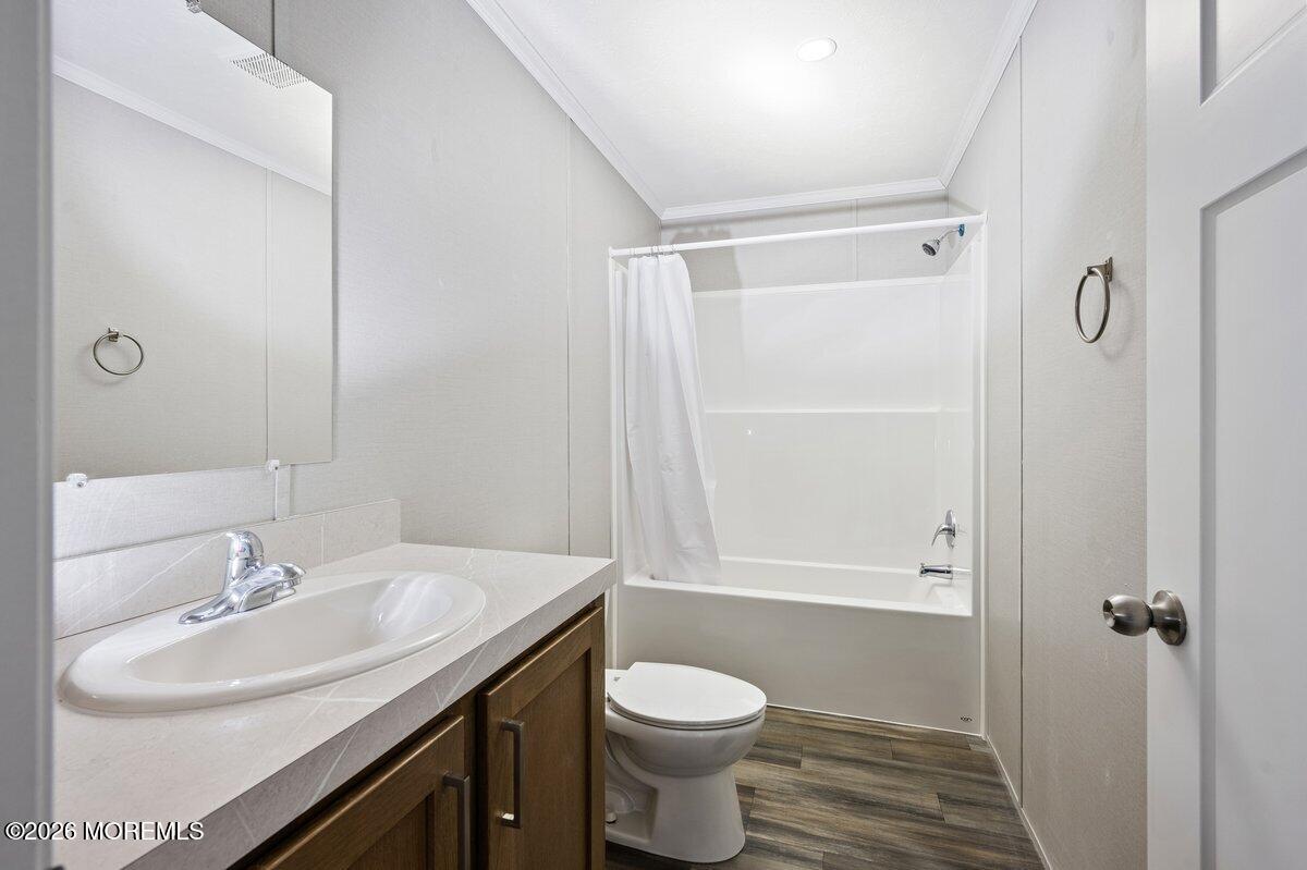 1820 State Rte 35, Unit 16 Wall, NJ 07719 - Photo 18 of 24 a bathroom with a sink toilet and shower