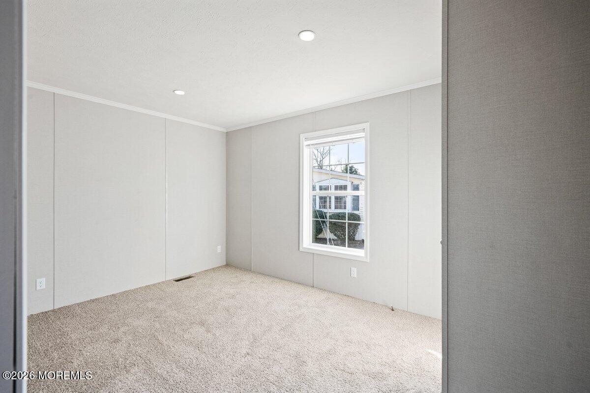 1820 State Rte 35, Unit 16 Wall, NJ 07719 - Photo 20 of 24 an empty room with windows